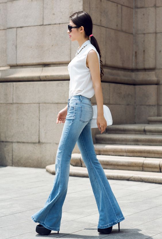 light blue flared jeans and black platform heels